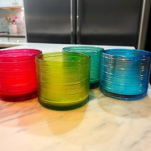 Four glass containers for candle making